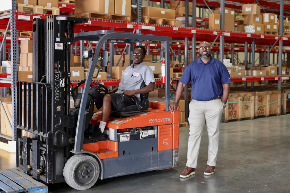 hydraquip employee on a forklift
